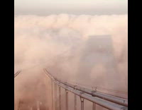 Nice view of scenery above the clouds on top of bridge