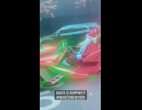 Santa plays his favorite bops in traffic