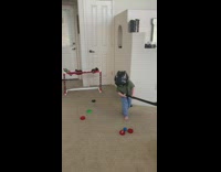 Boy plays indoor toy hockey 
