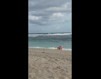 Two women violet bikini crawl toward beach Part 2