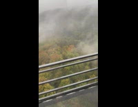 Clouds visible below the bullet train
