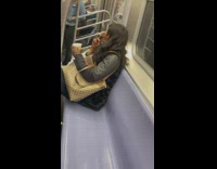 Woman Smokes Cigarettes on Subway Ride