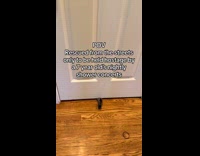 Cat paw under closed door