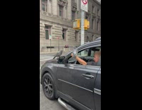 Guy sings with pigeons while driving 