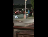 Woman in white outfit on the ground for better angle