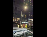 Man Sings Song Out Window at Night 