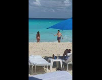 Old man walk around girl on beach
