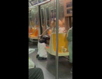 Person dressed in weird clothes sitting on subway