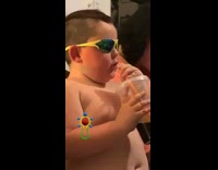 Shirtless little boy sunglasses drinking