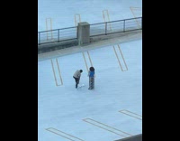 Man gray top remove pants on the rooftop parking lot