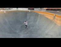 Guy skates in skate park and falls