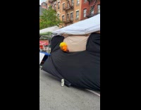 Puppet moves outside tent blanket and curtains