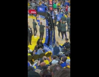 Woman black shirt pose beside basketball court