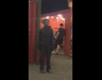 Two girls pretend to scream at michael meyers and he follows