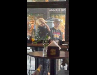 Man and Woman poses outside the restaurant