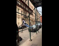 Man Does Push Up with Ropes on Construction Site 