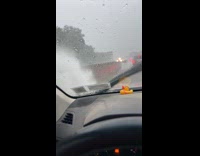 Car drive through road highway flood splashes water