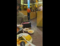 Guy tries to spin hot pot meat on chopstick 