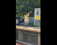 Collab Subway Creatures - Lady across train platform blows war horn  