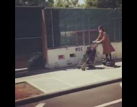 Girl rides hoverboard pushes empty black stroller 
