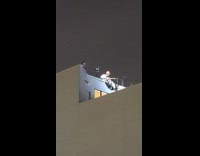 Duo films night music video at rooftop