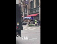 Person black cape ghost costume walks street 