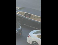 Girls in back of limo in traffic