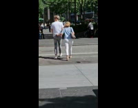 Collab WINY - Woman blue shirt hold pants of man while walking