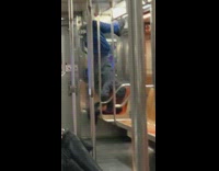Guy use leg hang on train handrails
