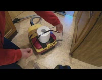 Guy tapes toilet paper roll to vacuum 