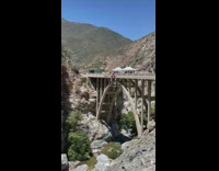 Guy goes bungee jumping off bridge 