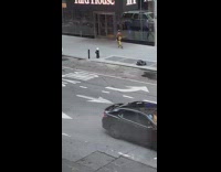 Shirtless man with yellow and black pants street