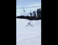 Skier flips off hillside and lands on his back, dislocates shoulder