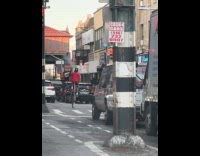 Guy rides bike with missing front tire