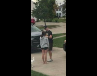 Guy kisses girlfriend on forehead and gives her a hug 