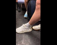 Person rides train wearing two different shoes