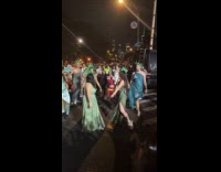 Group dances in statue of liberty costume