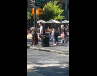 Garbage inside street trash can start to burn