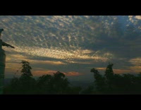 Time lapse of sunset overcast tree silhouette