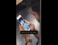 Guy decides which filter to use on selfie on subway train
