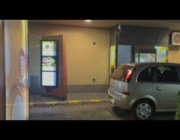 Man walks up and order at the drive thru area