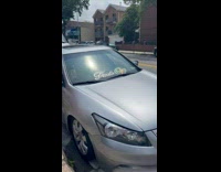 Collab WINY - Fuck off sticker on parked car's windshield