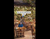 Girl sits rainforest cafe restaurant green screen