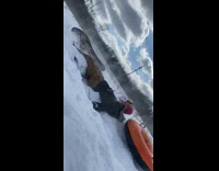 Guy on sled goes too fast and crashes into friend
