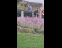 Girl black vest helmet purple flowers motorcycle