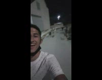 Two guys walk stray dogs follow 