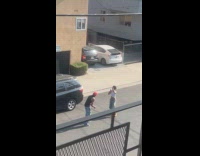 Man red cap video shoot on street