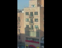 guy works out on balcony 