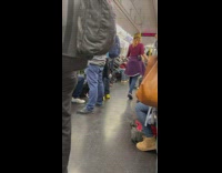 Girl tap dances in middle of subway 