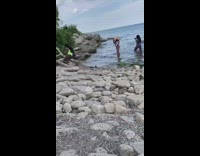 Green bikini girl fallen tree branches lake 